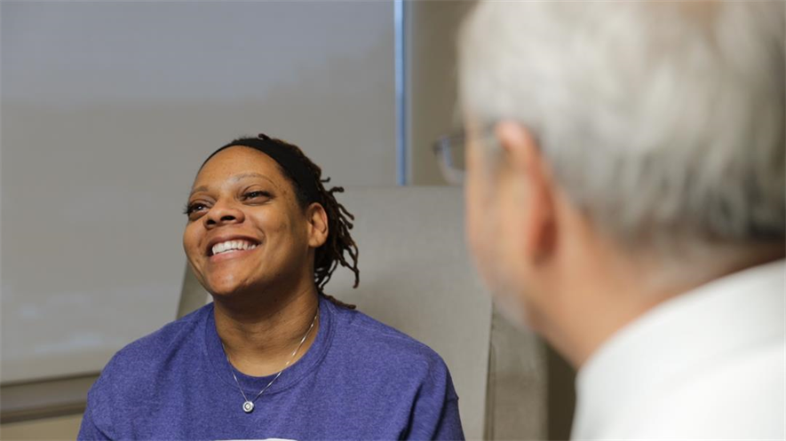 carol webber smiling with her doctor